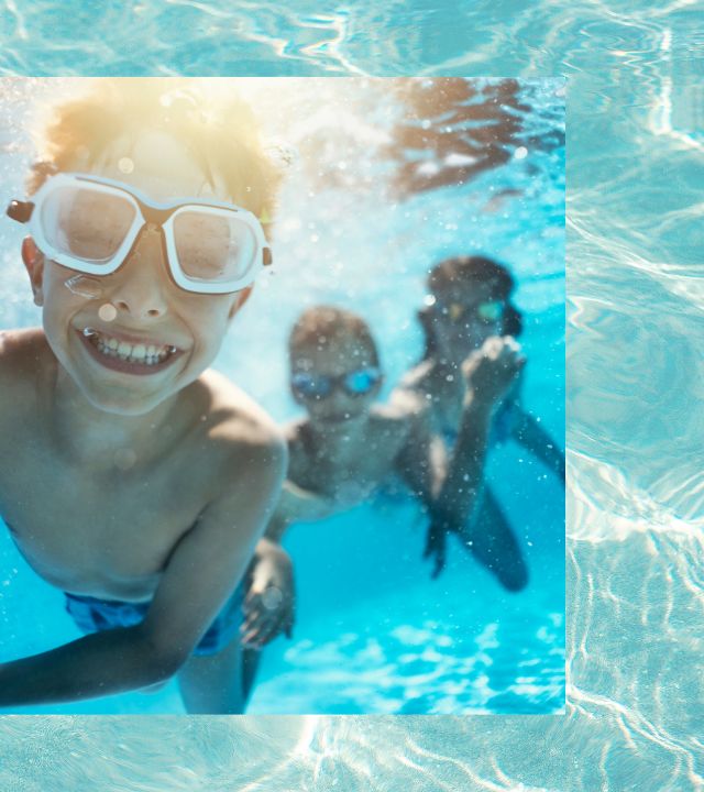 family playing in pool