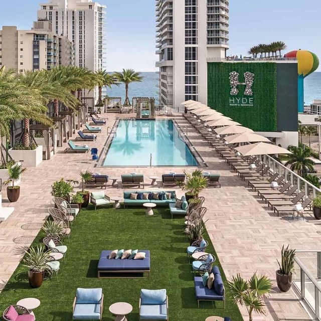 Hyde rooftop with a pool and grassy lounge area