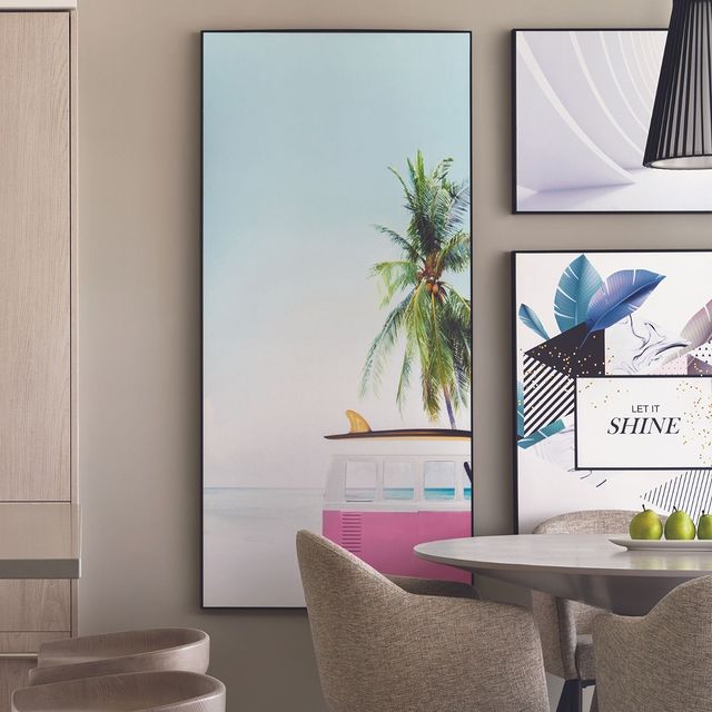 Indoor area with artwork and a dining table