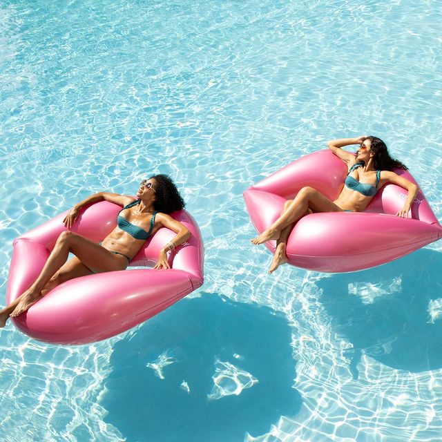 Ladies lounging on pool floaties